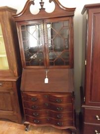 Vintage mahogany secretary. Excellent condition with all the drawers, and inside drawers intact and functions perfect. It even has the original key with operates all drawers and doors