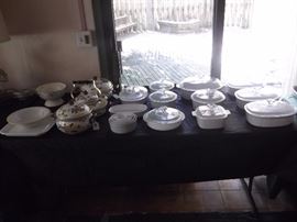 Pyrex and corning-ware plus enameled metal matching pots with matching tea kettle. 