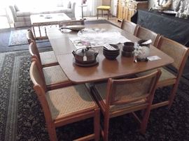 Oak table and eight chairs, comes with 2 leaves and also custom table pads.