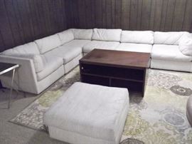 Burnhardt sectional. In need of a little cleaning, but this is a quality set which will last a lifetime. Very comfortable and also has an ottoman on wheels.