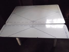 Vintage porcelain drop down table. Only a few minor spots where porcelain is worn, balance of the table is in great condition. Perfect for a small dining area with a great retro look.