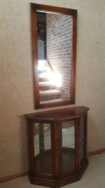 small curio with mirror