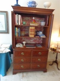A beautiful mahogany storage armoire with 6 drawers