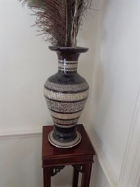 A pair of papier mache vases, inlaid with mother of pearl. They are a large size and very impressive, one has been repaired, but is hard to find.  These are very good.