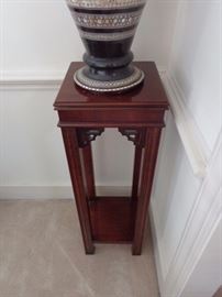 A pair of Chippendale style mahogany square stands