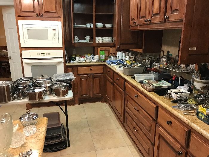 Lots of pots and pans and kitchen items