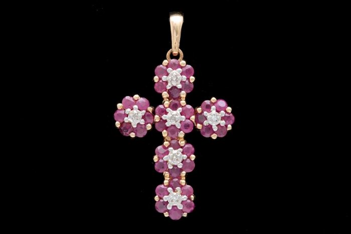 14K Yellow Gold, 1.50 CTW Ruby, and Diamond Cross Pendant: A 14K yellow gold, 1.50 ctw ruby and diamond cross pendant. This cross pendant features six clusters of rubies, with center diamonds, set in a 14K yellow gold mount. The pendant hangs from a single bail and is stamped 585, d’aio to the back.