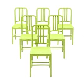 Set of Six Green "111-Navy" Recycled Chairs: A set of six 111-Navy side chairs, by Coca-Cola and Emeco. Each is molded from 111 recycled plastic Coca-Cola bottles, having manufacturing description molded in raised lettering, to seat bottom. The durable chairs have a green finish, featuring a curved back rail, over three center splats and molded seat and legs. See 17CIN532-159, for the related item.