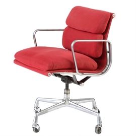 Vintage Eames for Herman Miller "Aluminum Group" Desk Chair: A vintage Aluminum Group chair designed by Charles and Ray Eames for Herman Miller. This office chair is designed with a padded back and seat finished in a deep red upholstery, fixed aluminum arms and a swivel base on wheels. It is marked to the underside with a Herman Miller sticker and the number “355660.”