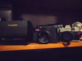 Cameras: Polaroid Sun AutoFocus 660, TIME, PhotoFLEX MX-35. 