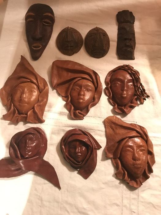 These are vintage leather faces! Also some wood carved ones. 