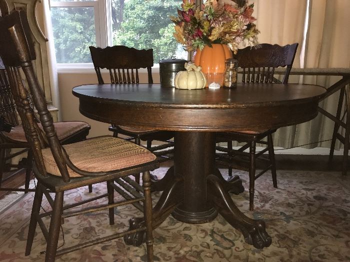 Beautiful sturdy claw foot table and four chairs