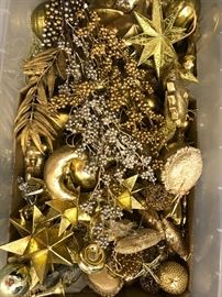 A box of ornaments for one of the themed trees. Sun moon stars all golden