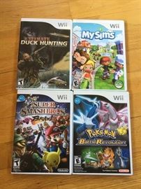 Wii Games and Wii system with multiple controllers Wii Duck hunting, Wii Play, Wii super smash brawl, Wii Pokeman Revolution, Wii My Simms
