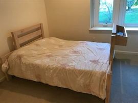 Light wood, full sized bed comes along with detachable shelf that can be repositioned as desired. - $200