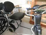 two motorized scooters, two folding walkers, two folding wheelchairs