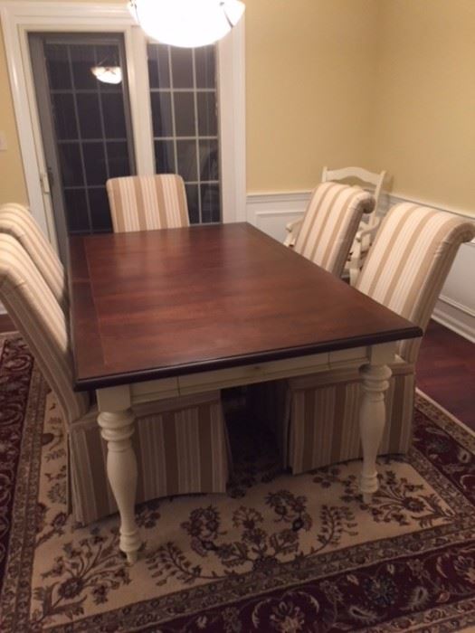Farmhouse table like new with six upholstered chairs from Carson's