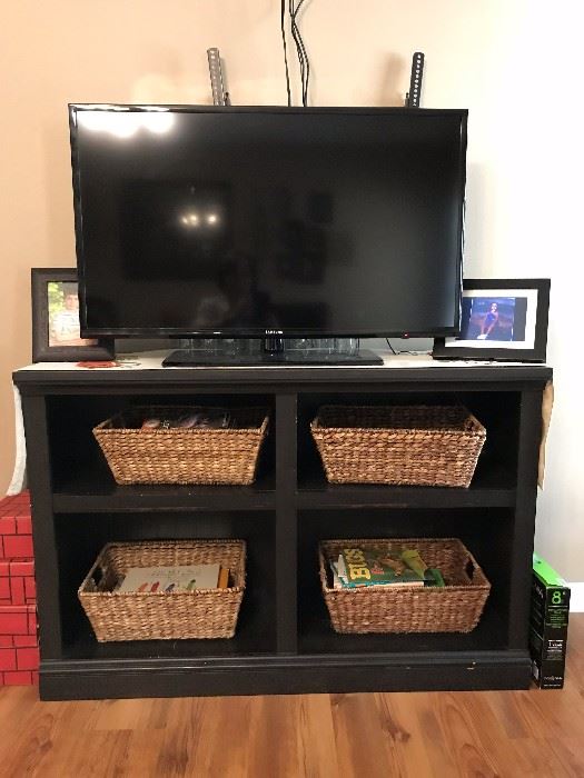 TV cabinet and wicker cabinets.  42" flat screen TV.  Also available is a TV wall mount that holds up to a 65" flat screen TV.