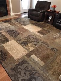 Very large area rug in browns and blues.  152" Long X 118" Wide