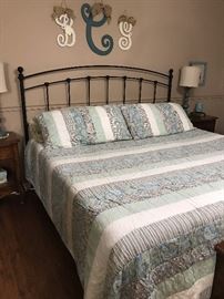 Very nice comforter and pillow shams in blues and browns.  Mattress is king sized memory foam.  King sized metal headboard and bed frame.