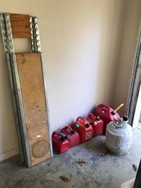 Heavy duty rack and 2 shelves.  Also several gas cans and propane tank.