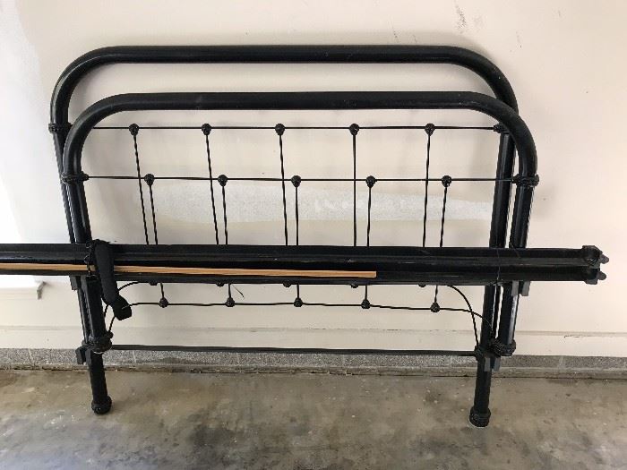 Antique iron bed with rails and mattress slats.  Also another vintage metal bed.  Both full size.