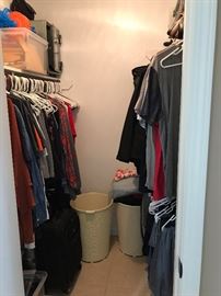 Closet full of men's clothes, shoes and outerwear.