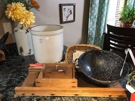Antique cabbage cutter, crock and enamelware strainer.