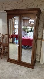 Beautiful mirror front armoire.