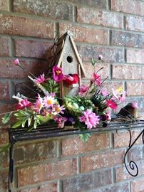 Colorful birdhouse yard art