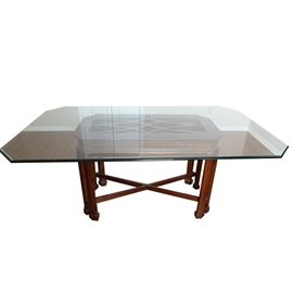 Contemporary Chippendale Style Dining Table: A contemporary Chippendale style dining table in mahogany, having a rectangular glass top with chamfered corners, resting on a mahogany framed base, having a decorative muntin grill, blind-fretwork carved border and eight fluted legs with block feet and X-stretcher.