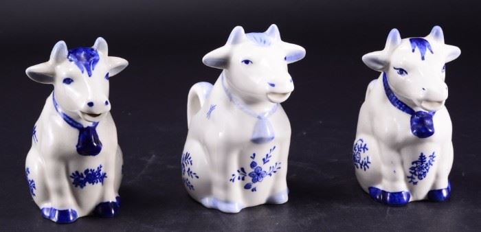 Lot 60: Three Blue & White Sitting Cow Creamers