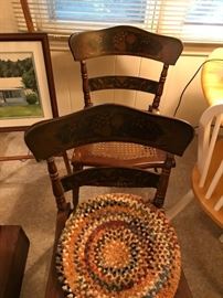 2 of a set of3 hand painted painted, cane bottomed chairs.  One has a damaged seat.