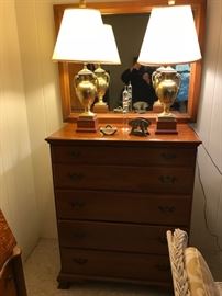 Dresser with mirror and pair of "trophy" lamps.