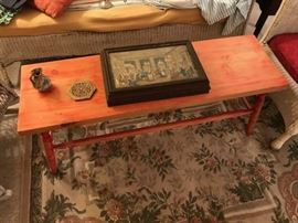 Painted bench showing the large wooden box.