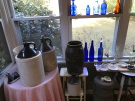 Antique juge, crocus and bottles.