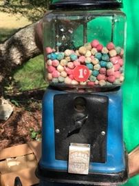 Vintage gum ball machine complete with vintage melted gun balls.  We're looking for the key!