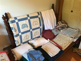 Antique bed with part of the collection f antique and vintage quilts.