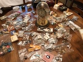 Costume jewelry with a domed Anniversary clock.