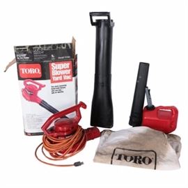 Toro Electric Leaf Blower with Extension Cord and One Gallon Gas Can: A Toro electric leaf blower with extension cord and one gallon gas can. This selection of tools includes a Toro Super Blower yard vac with hand held blower, extension hose, extension cord and trimmer bag. Blower comes with a red one gallon gas can with handle and funnel attachment.