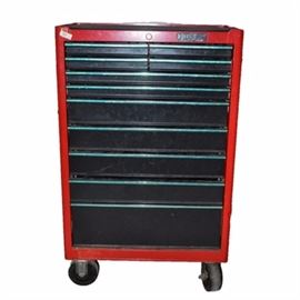 Husky Metal Rolling Toolbox: A Husky metal rolling toolbox. The toolbox is red metal with a rubber ridged mat on the top. The box features eight drawers and wheels.
