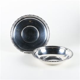 International "Prelude" Sterling Silver Vegetable Dish and Tray: An International sterling silver vegetable dish and tray in the Prelude pattern. Bowl and tray both feature unadorned sterling silver bodies with a die-cast foliate detailed rim. Both items are marked on the underside “International Sterling Prelude”. The total approximate weight is 19.02 ozt.