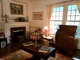 Mahogany Furnishings, Slag Glass Lamps, Fine Artworks...  the best of what's around.