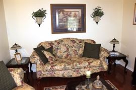 Side table, sofa, artwork, lamps, wall sconces