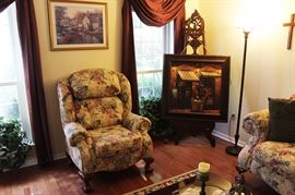 Arm chair, artworks, easel, floor lamp