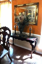 Entry table, mirror, candlesticks, floral arrangement