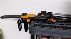 electrical chain saw on arm for tree limbs 