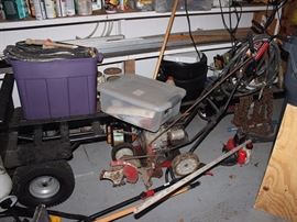 mower, hoses, weed eater, boat dolley