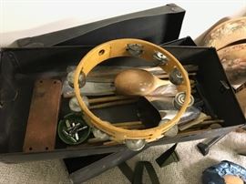 vintage case full of percussion instruments 