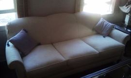 cream three cushion sofa